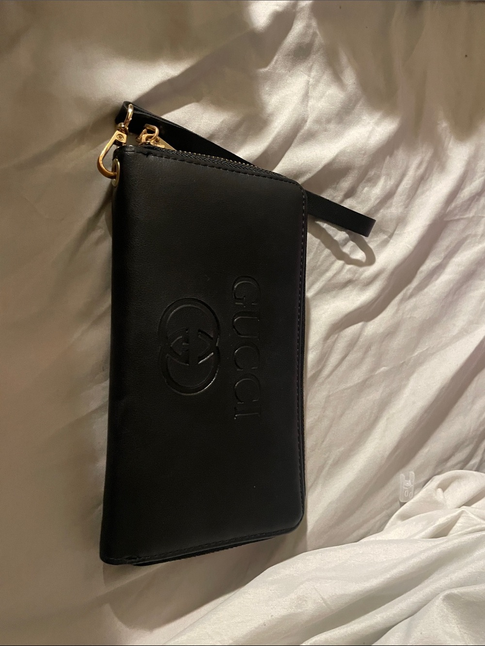 Gucci Black Leather Wristlet with Embossed Logo and Gold-Tone Hardware